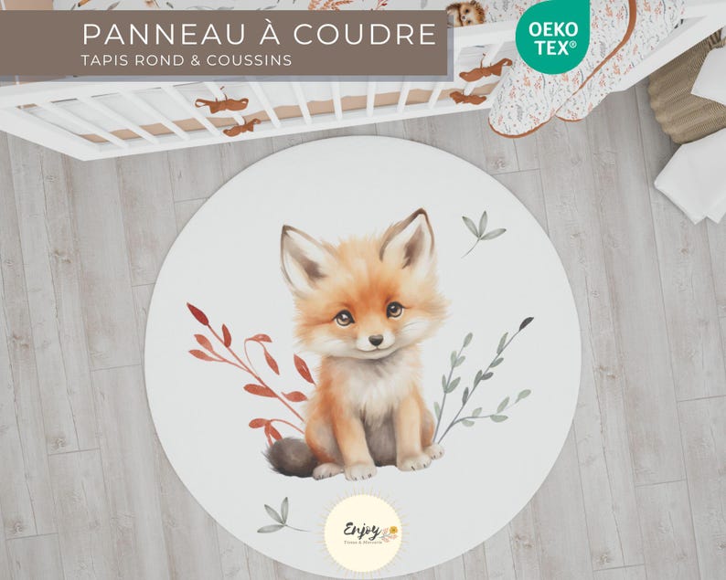 May include: A white round play mat featuring a cute fox illustration. The fox is sitting on a bed of red and green leaves. The text "Enjoy" is printed on the mat.