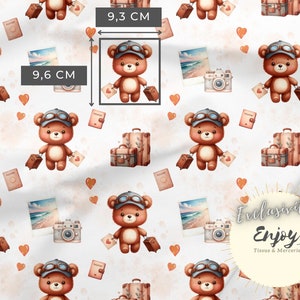 May include: A seamless pattern featuring brown teddy bears wearing aviator goggles and carrying suitcases. The bears are surrounded by hearts, vintage cameras, and passport covers. The pattern is on a white background and includes the text "Exclusive Enjoy Tissus & Mercerie".