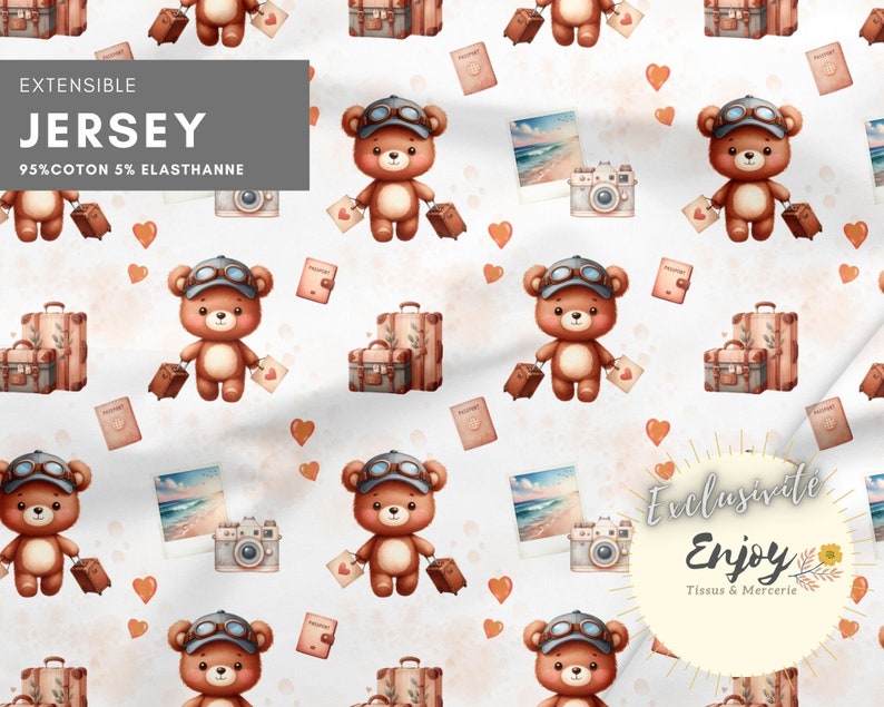 May include: A seamless pattern featuring a brown teddy bear wearing aviator goggles and carrying a suitcase. The pattern also includes hearts, cameras, and luggage tags. The text "EXTENSIBLE JERSEY 95% COTTON 5% ELASTHANNE" is at the top of the image. The text "Exclusive Enjoy Tissus & Mercerie" is at the bottom of the image.