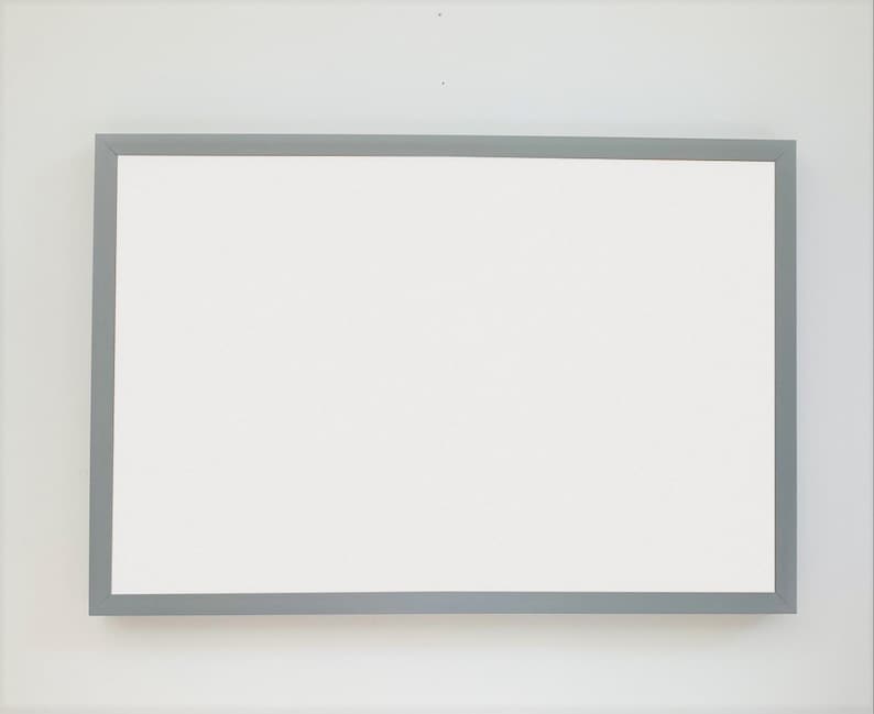 May include: A white rectangular whiteboard with a silver frame.
