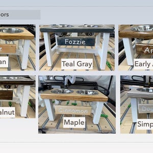 May include: A set of six double dog bowls with a variety of wood finishes and colors. The bowls are elevated on white legs and have a personalized nameplate. The wood finishes include pecan, teal gray, early American, dark walnut, maple, and simply white.