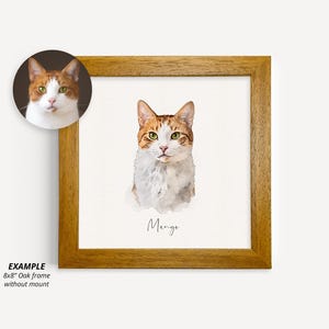 May include: A watercolor painting of a cat named Mango in an 8x8 inch oak frame. The cat is orange and white with green eyes. The painting is on a white background.
