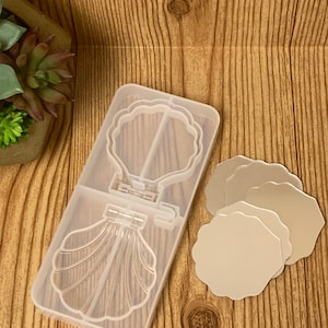 May include: Clear silicone mold for making resin crafts. The mold features a seashell design with a mirror inside. Three separate round mirror molds are also included.