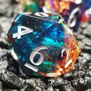 Sage’s Enchanted Rainbow Crystals – Sharp Edge Resin Polyhedral Dice Set