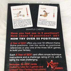 May include: A Year of SEX! card game in a sealed package. The black box features sample cards with illustrations and instructions for various positions. The text on the box reads "NOW TRY OVER 50 POSITIONS!" and includes 54 cards.