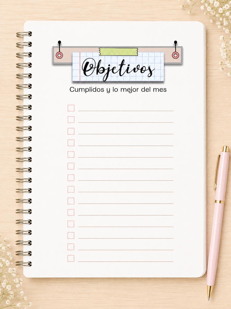 May include: A spiral-bound notebook with white pages featuring a grid-patterned header that reads "Objetivos" and the text "Cumplidos y lo mejor del mes" below it. The page includes a checklist with fifteen horizontal lines and empty square boxes.