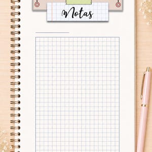May include: A spiral-bound notebook page featuring a grid pattern and a rectangular paper cutout at the top. The cutout is attached with a piece of light green tape and displays the word "Notas" in black cursive script against a grid background.