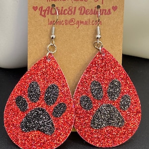 Sparkling red with black paw prints