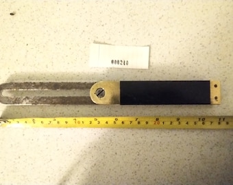 large carpenter's sliding bevel in ebony and brass cleaned and restored for use. A well used tool