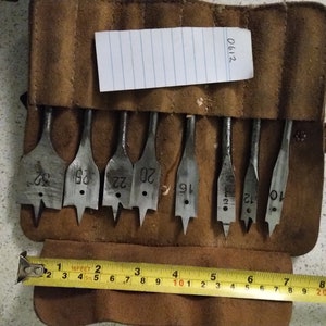 Set of spade bits in a leather roll. All sharpened ready for use and in excellent condition