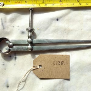 May include: A set of three ceramic mugs with a speckled, matte finish. Each mug features a different color: light blue, cream, and gray. The mugs have a simple, modern design and a comfortable handle.