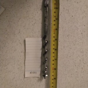 This is a 9/16" drill bit for brace and bit by Footprint of Sheffield  in good condition. Cleaned and re- sharpened ready for use.