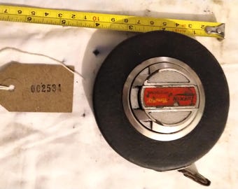 Lufkin steel tape rule. A bit battered but still usable [002534]