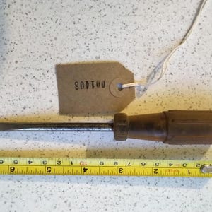 Medium/small plastic handled flathead screwdriver in good condition, cleaned and reground ready for use. [001408]