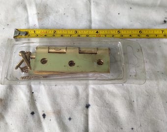 one pair brass hinges. New old stock in original packaging. [002902]
