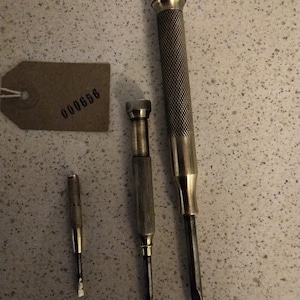 fine screwdrivers  - possibly watchmakers tools with brass handles.  Unusual and quite pretty. All useable tools.