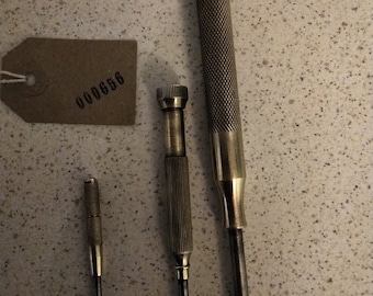 fine screwdrivers  - possibly watchmakers tools with brass handles.  Unusual and quite pretty. All useable tools.