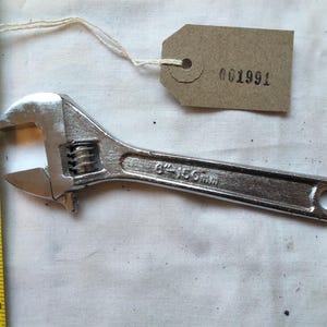 Small (6 inch) adjustable wrench in mint condition. [001991]