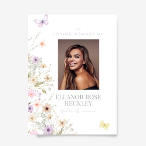 May include: A memorial card featuring a photograph of a smiling woman, framed by watercolour floral illustrations in pastel hues. The text reads "IN LOVING MEMORY OF" and the name "ELEANOR ROSE HECKLEY", with "Order of service" below. Butterflies are also included.