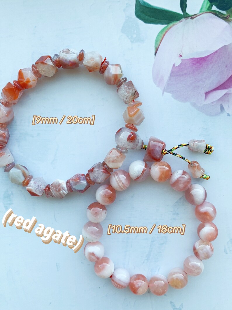 May include: Two red agate bracelets. The larger bracelet has round beads and measures 10.5mm in diameter and 18cm in length. The smaller bracelet has faceted beads and measures 9mm in diameter and 20cm in length.