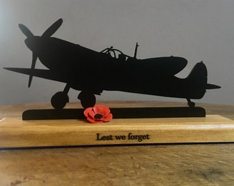 WW2 RAF Spitfire, Remembrance Day, wooden silhouette and 3D poppy, engraved 'Lest we forget'.