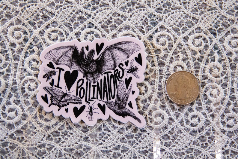 May include: A pink sticker with a black and white illustration of a bat, hummingbird, butterfly, and bees. The sticker says "I love pollinators" with a heart in place of the "O".