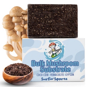 May include: A white box with a cartoon mushroom character surfing on a wave. The box says "Bulk Mushroom Substrate" and "Coco Coir | Vermiculite | Gypsum" and "Surfin' Spores". There is a brown brick of mushroom substrate and a bunch of brown mushrooms.
