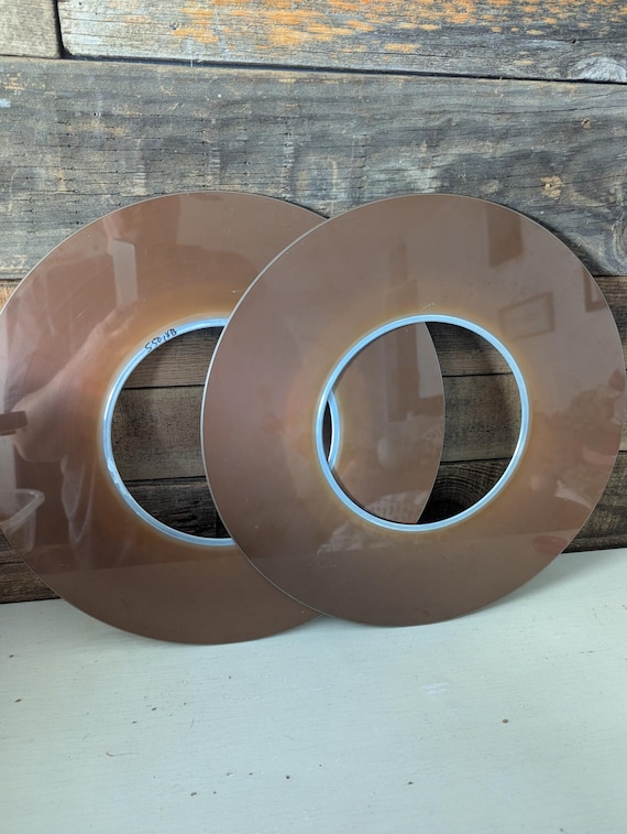 Actual hard drive platters — the mirrored discs that once stored data — turned into wall art that celebrates tech history without being tacky.