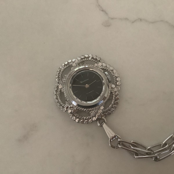 VENDOME, 17 jewels, Lady’s pendant watch, Silver in colour, Double intricate decorative link trims watch face, Stylish day or night wear,