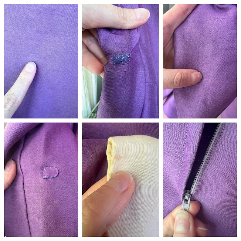 May include: Close-up of a purple zippered sweater with a few small holes. The sweater is made of a soft, stretchy fabric. The zipper is silver and has a small pull tab.