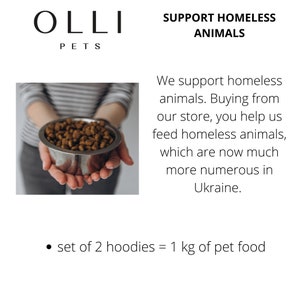 May include: A silver metal bowl filled with brown dry pet food. The text reads: OLLI PETS, SUPPORT HOMELESS ANIMALS, We support homeless animals. Buying from our store, you help us feed homeless animals, which are now much more numerous in Ukraine. set of 2 hoodies = 1 kg of pet food.
