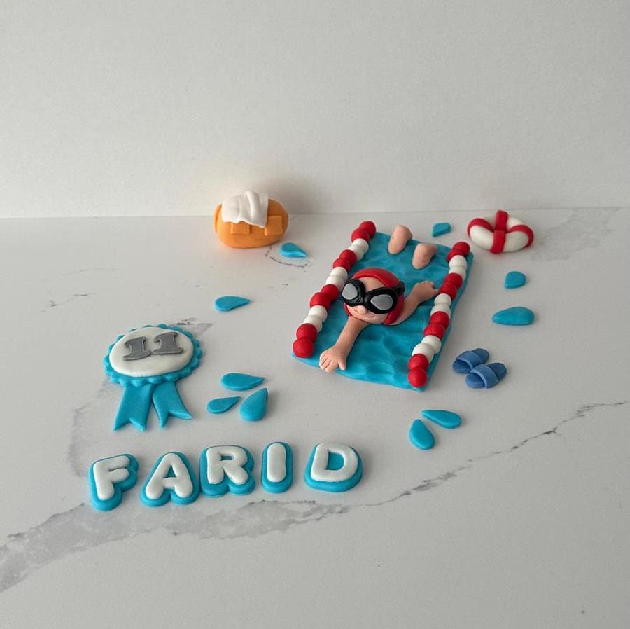 EDIBLE Handmade Swimmer in the Lane cake topper with personalised name and age.
