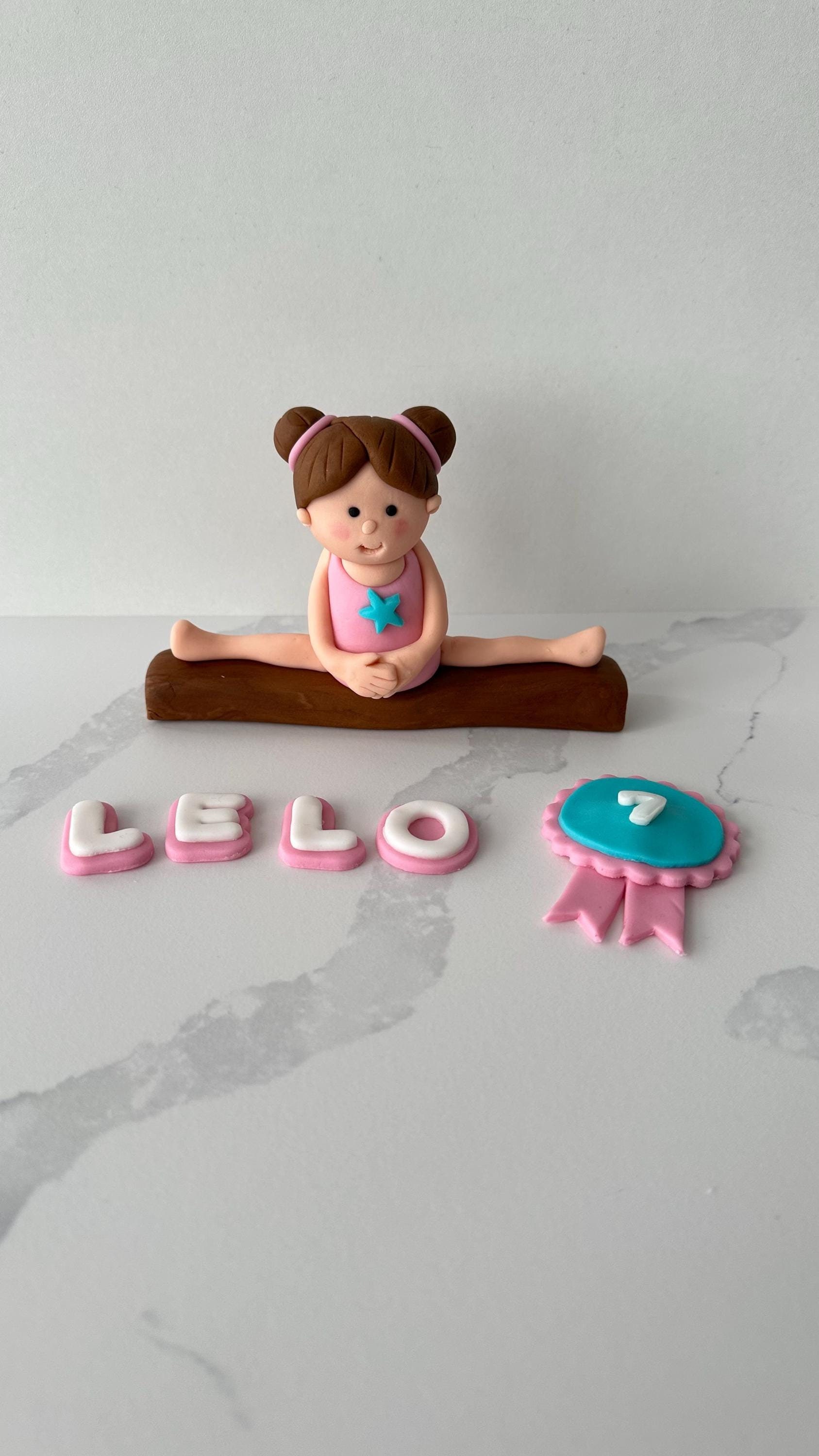 EDIBLE handmade GYMNASTICS GIRL on a beam and a ribbon.