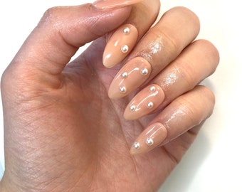 Pearl | Natural Pearl Press on Nails in Medium Almond.