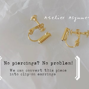 May include: A pair of gold clip-on earrings. The earrings are made of metal and have a simple design. The text "No piercings? No problem! We can convert this piece into clip-on earrings" is visible in the image.