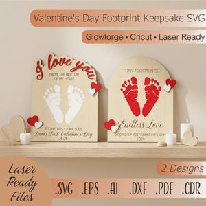 May include: Two wooden Valentine's Day keepsakes with footprint designs. One features white footprints and the text "I love you." The other has red footprints and the words "Endless Love." Both have heart accents and are laser-ready.