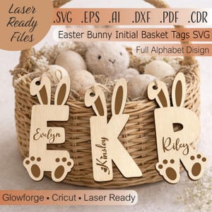 May include: Wooden Easter bunny initial basket tags. The tags are in the shape of letters with bunny ears and paw prints. The names Evelyn, Kinsley, and Riley are engraved on the letters. The basket is filled with eggs and a stuffed bunny. The text reads "Laser Ready Files".