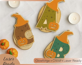 May include: Wooden Halloween alphabet tags in the shape of letters A, C, and B, each with a witch hat and pumpkin design. The letters are painted in green, brown, and teal with orange accents. The text "Halloween Alphabet Tags" is at the top.