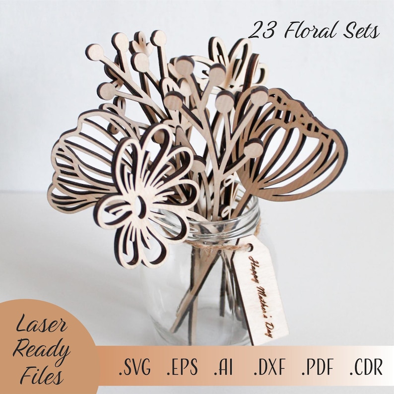 May include: A set of 23 laser-cut floral designs in a glass vase. The flowers are made of wood and have a natural finish. The vase is clear glass and has a rustic twine bow around the neck. The flowers are arranged in a bouquet and have a variety of shapes and sizes. The text "Happy Mother's Day" is written on a wooden tag attached to the vase. The files are available in SVG, EPS, AI, DXF, PDF, and CDR formats.