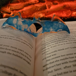 Blue and clear bat page book holder