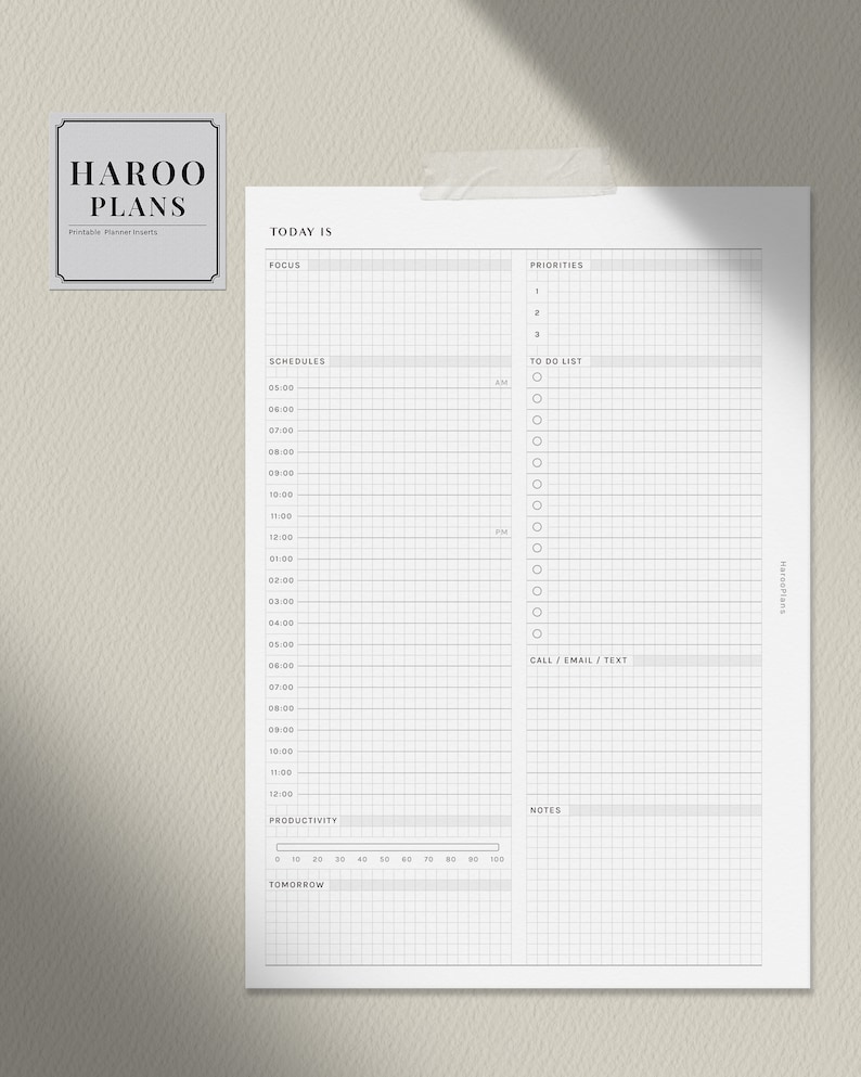 May include: A printable daily planner page with a grid layout. The page includes sections for focus, priorities, schedules, to-do list, call/email/text, notes, and productivity.