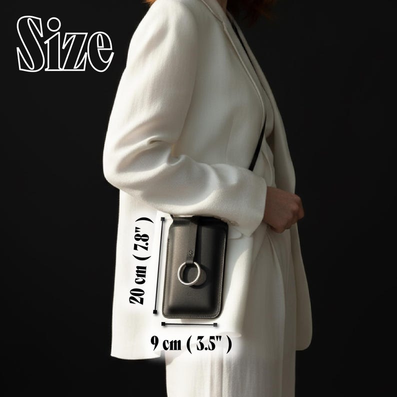 May include: Black crossbody phone bag with a silver ring detail. The bag is 7.8 inches (20 cm) tall and 3.5 inches (9 cm) wide. The word "Size" is written in white script at the top left.