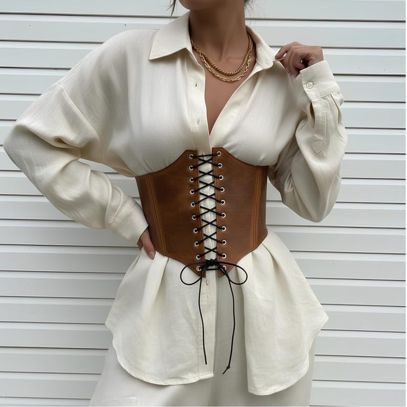 Elevate your style with our Underbust leather corset, a handmade wide leather corset belt crafted from premium leather. Perfect for renaissance fairs, festivals, or modern outfits, this leather cincher belt flatters the waist and adds bold elegance. Adjustable for comfort, it’s a unique blend of history and fashion—an accessory that transforms any look.