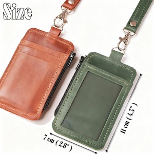 May include: Two leather ID badge holders with lanyards. One is brown, the other is green. The green holder has a clear window and measures 4.5 inches (11 cm) tall and 2.8 inches (7 cm) wide. Both have a zipper closure and metal clasp.