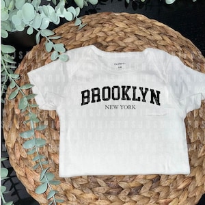 Brooklyn Baby Onesie®, NYC borough baby, Cool Urban Style for Your Mini New Yorker- Someone in New York Loves Me Baby Bodysuit