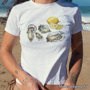 Camiseta para bebé Oyster, camiseta para bebé vintage Y2k 2000, camiseta para bebé de mariscos, verano italiano, estética de chica concha marina, nieta costera