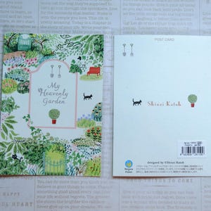 May include: A postcard featuring a colorful illustration of a garden with a pink sign that reads "My Heavenly Garden". The postcard is designed by Shinzi Katoh.
