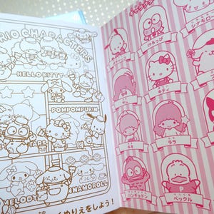 May include: A coloring book featuring Sanrio characters. The cover shows a pink and white striped background with illustrations of Hello Kitty, Pompompurin, and other Sanrio characters. The title of the book is "Sanrio Characters".