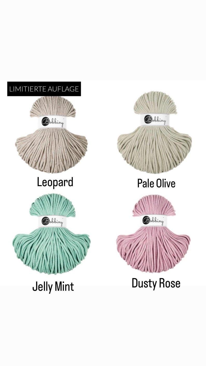 May include: Four skeins of Bobbiny cord in Leopard, Pale Olive, Jelly Mint, and Dusty Rose colors. Each skein is secured with a white paper band featuring the Bobbiny logo. The top left skein includes a black label with the text LIMITIERTE AUFLAGE.