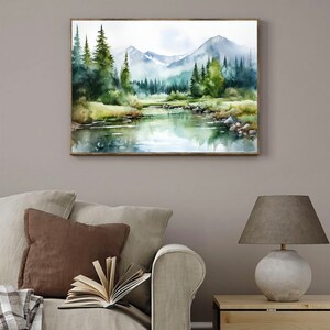 May include: Watercolor painting of a mountain landscape with a river flowing through a forest. The mountains are in the background, and the river is in the foreground. The trees are green and lush, and the water is clear and blue.
